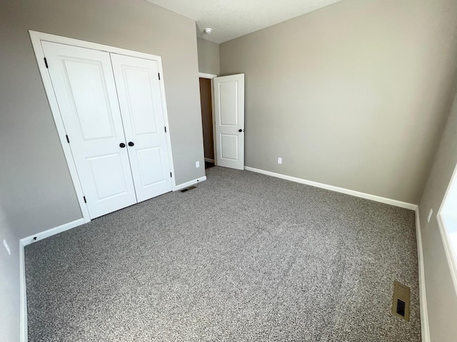 4818 163rd St N, Hugo, MN 55038 - unfurnished bedroom with a closet, carpet, and baseboards