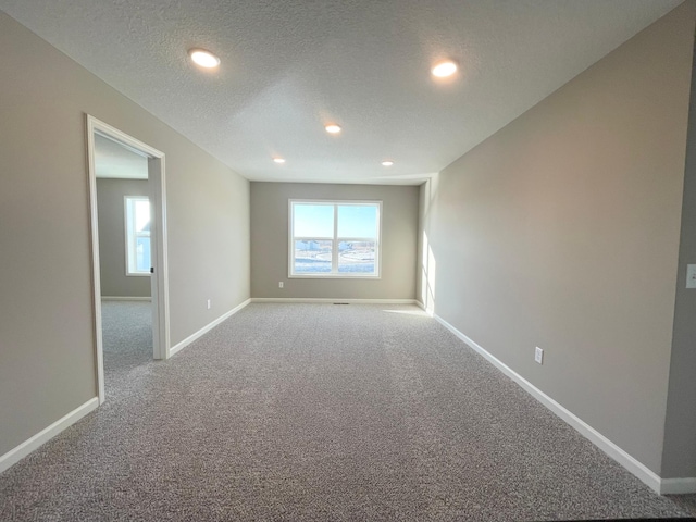 4818 163rd St N, Hugo, MN 55038 - empty room featuring carpet, recessed lighting, baseboards, and a textured ceiling