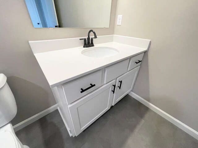 4818 163rd St N, Hugo, MN 55038 - half bathroom with vanity, baseboards, toilet, and concrete floors