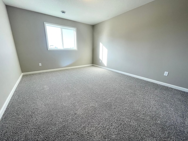 4818 163rd St N, Hugo, MN 55038 - empty room with carpet floors, baseboards, and a smoke detector