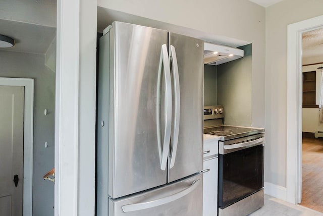 517 Birch Ave, Moose Lake, MN 55767 - kitchen with appliances with stainless steel finishes, under cabinet range hood, white cabinets, baseboards, and light wood-style floors