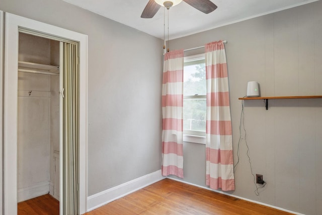 517 Birch Ave, Moose Lake, MN 55767 - empty room with wood finished floors and a ceiling fan