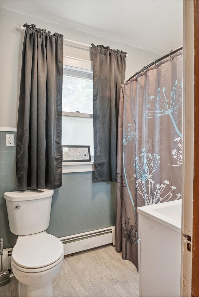 517 Birch Ave, Moose Lake, MN 55767 - full bath with baseboard heating, toilet, and vanity