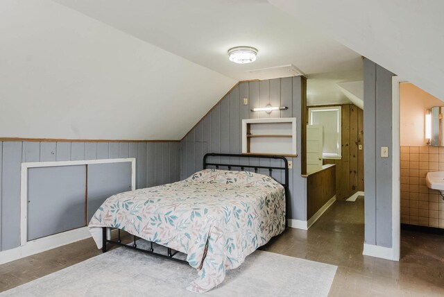 517 Birch Ave, Moose Lake, MN 55767 - bedroom featuring lofted ceiling and wood walls