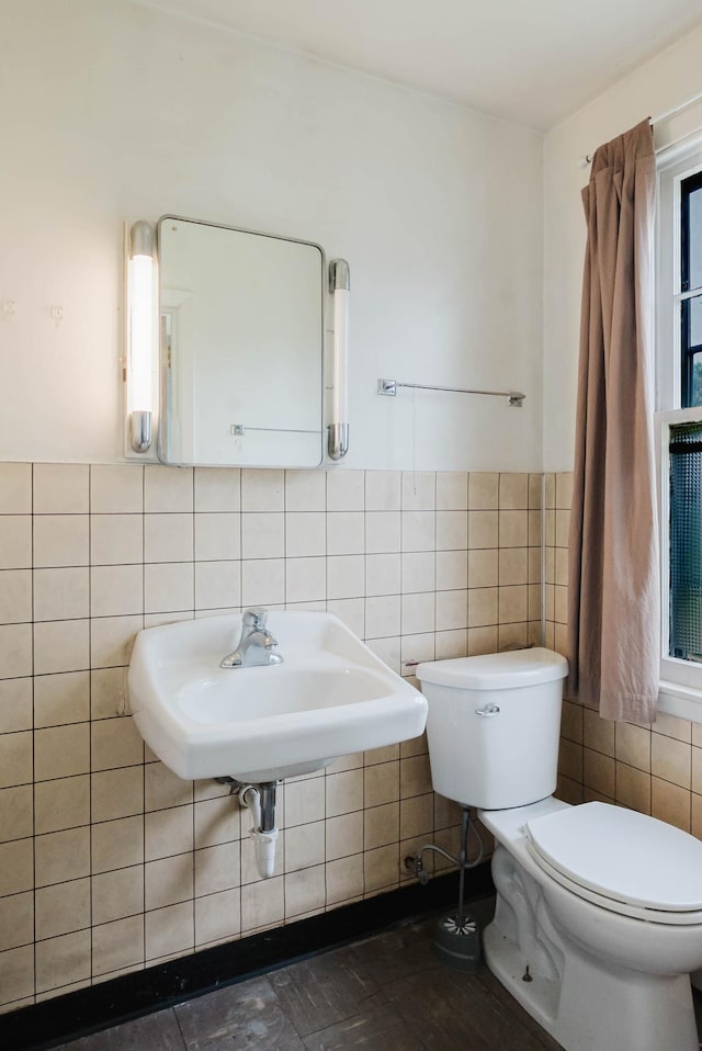 517 Birch Ave, Moose Lake, MN 55767 - half bath with tile walls, toilet, and a sink