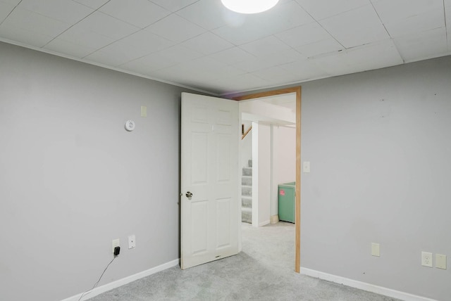 517 Birch Ave, Moose Lake, MN 55767 - empty room with stairs, carpet flooring, baseboards, and a paneled ceiling