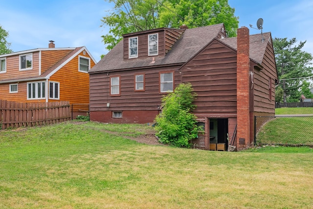 517 Birch Ave, Moose Lake, MN 55767 - rear view of house featuring a chimney and a shingled roof