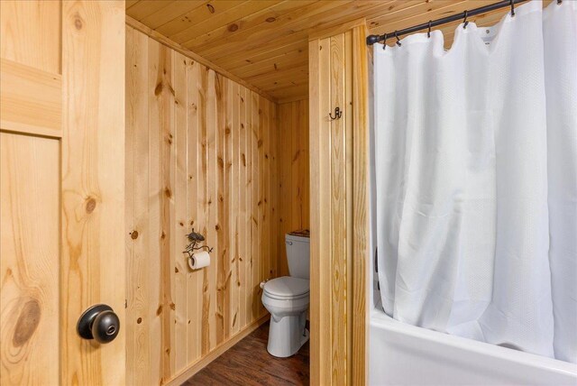 134315 Lone Pine Ln, Garfield Twp, WI 54001 - bathroom featuring wooden ceiling, wood finished floors, toilet, shower / bath combination with curtain, and wooden walls