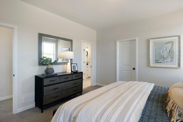 12443 Drayton Trl, Apple Valley, MN 55124 - carpeted bedroom featuring baseboards and ensuite bath
