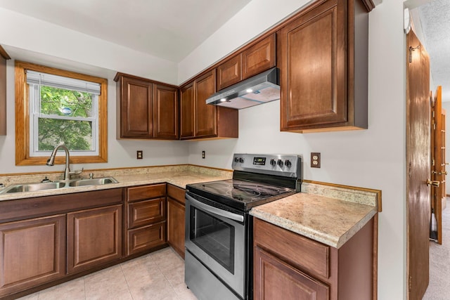 1809 Penn Ave N, Minneapolis, MN 55411 - kitchen with stainless steel electric range oven, under cabinet range hood, a sink, and light countertops