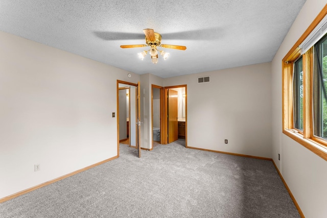 1809 Penn Ave N, Minneapolis, MN 55411 - unfurnished bedroom featuring carpet floors, baseboards, a textured ceiling, and a ceiling fan