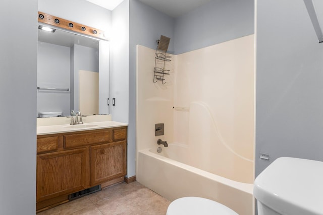 1809 Penn Ave N, Minneapolis, MN 55411 - full bathroom featuring toilet, vanity, tub / shower combination, and tile patterned floors