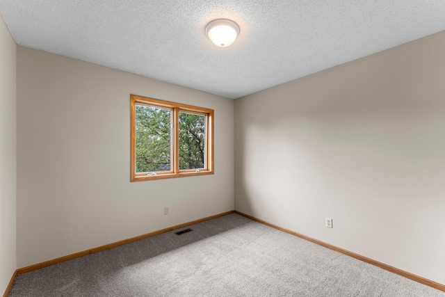 1809 Penn Ave N, Minneapolis, MN 55411 - carpeted empty room featuring baseboards and a textured ceiling