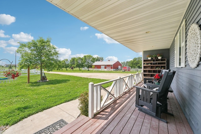 7482 250th St, New Market Twp, MN 55020 - wooden porch featuring a yard