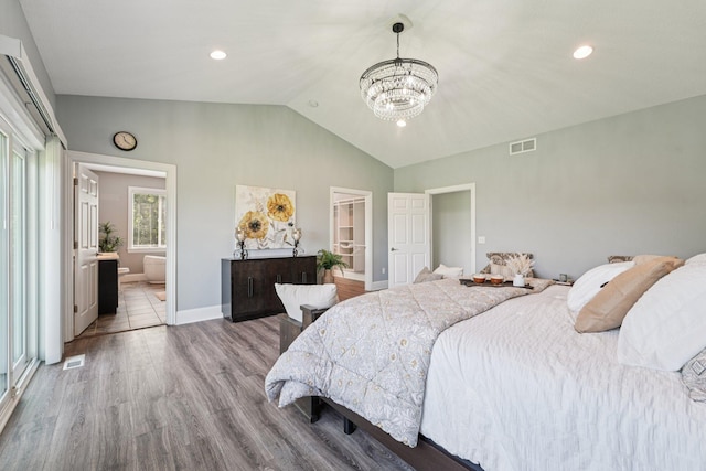 7482 250th St, New Market Twp, MN 55020 - bedroom featuring a chandelier, lofted ceiling, wood finished floors, recessed lighting, and ensuite bathroom