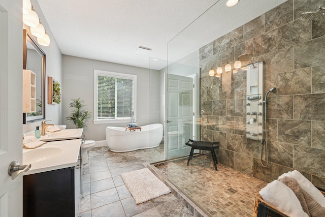 7482 250th St, New Market Twp, MN 55020 - full bath featuring double vanity, a walk in shower, a freestanding bath, and a textured ceiling