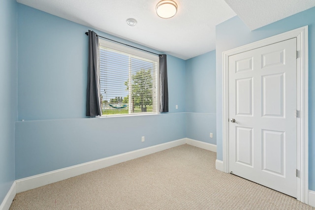 7482 250th St, New Market Twp, MN 55020 - unfurnished bedroom with carpet flooring and baseboards