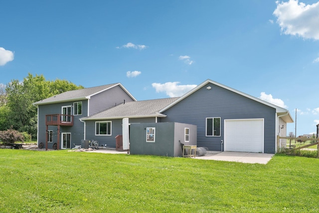 7482 250th St, New Market Twp, MN 55020 - back of property with an attached garage, a lawn, a balcony, and a patio area