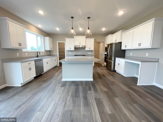 16290 Fairoaks Ave N, Hugo, MN 55038 - kitchen featuring appliances with stainless steel finishes, under cabinet range hood, a center island, dark wood finished floors, and white cabinets