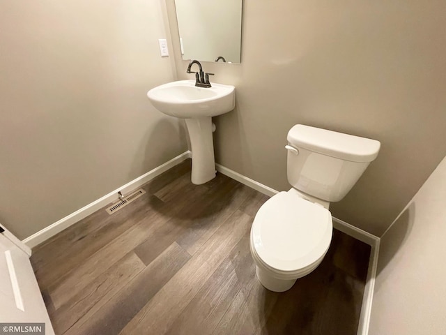 16290 Fairoaks Ave N, Hugo, MN 55038 - half bathroom with toilet and wood finished floors