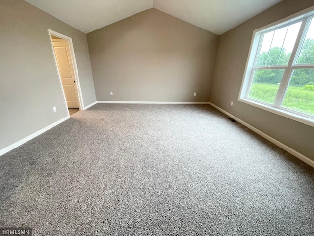 16290 Fairoaks Ave N, Hugo, MN 55038 - carpeted empty room with baseboards and lofted ceiling