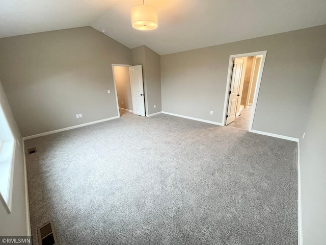 16290 Fairoaks Ave N, Hugo, MN 55038 - unfurnished bedroom with lofted ceiling, carpet floors, and ensuite bath