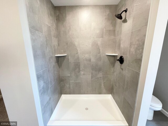 16290 Fairoaks Ave N, Hugo, MN 55038 - bathroom featuring a tile shower and toilet