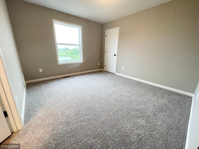 16290 Fairoaks Ave N, Hugo, MN 55038 - carpeted empty room featuring baseboards