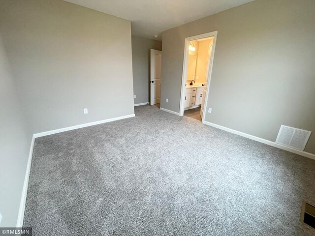 16290 Fairoaks Ave N, Hugo, MN 55038 - unfurnished bedroom featuring carpet flooring and ensuite bathroom