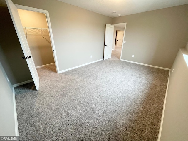 16290 Fairoaks Ave N, Hugo, MN 55038 - unfurnished bedroom with carpet floors, a spacious closet, and a closet