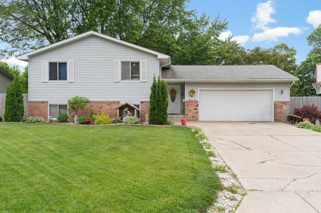 2040 6th Ave NE, Owatonna, MN 55060 - tri-level home featuring brick siding, an attached garage, and driveway