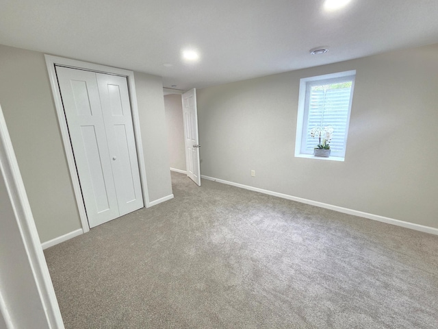 4106 Woodbine Ln N, Brooklyn Center, MN 55429 - unfurnished bedroom featuring carpet flooring, baseboards, and a closet