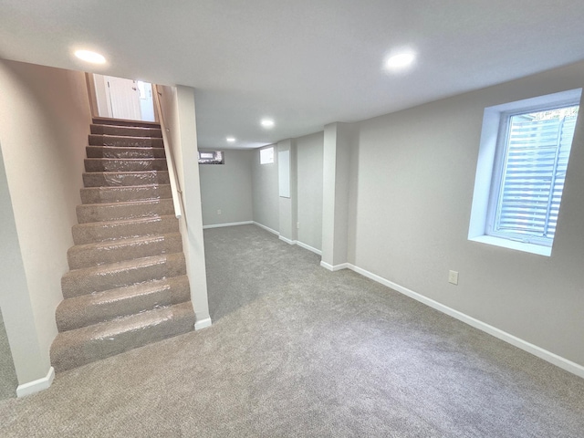 4106 Woodbine Ln N, Brooklyn Center, MN 55429 - below grade area with carpet, stairway, recessed lighting, baseboards, and plenty of natural light