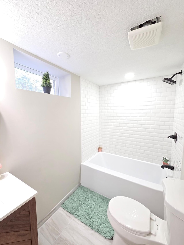 4106 Woodbine Ln N, Brooklyn Center, MN 55429 - full bath featuring toilet, vanity, bathtub / shower combination, a textured ceiling, and baseboards