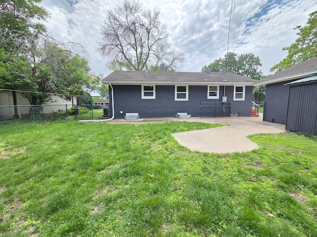 4106 Woodbine Ln N, Brooklyn Center, MN 55429 - rear view of house with a patio