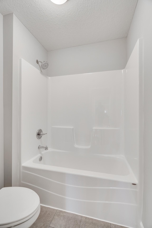 16296 Fairoaks Ave N, Hugo, MN 55038 - bathroom with toilet, shower / bath combination, a textured ceiling, and tile patterned flooring