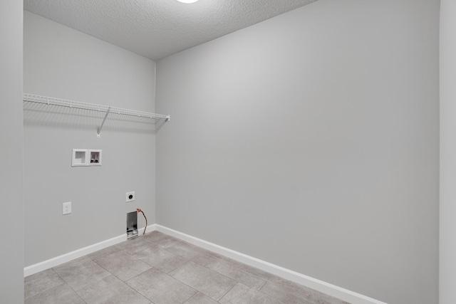 16296 Fairoaks Ave N, Hugo, MN 55038 - laundry area with electric dryer hookup, washer hookup, baseboards, and a textured ceiling