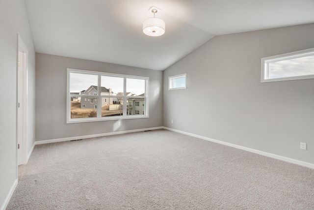 16296 Fairoaks Ave N, Hugo, MN 55038 - empty room with lofted ceiling, carpet floors, and baseboards