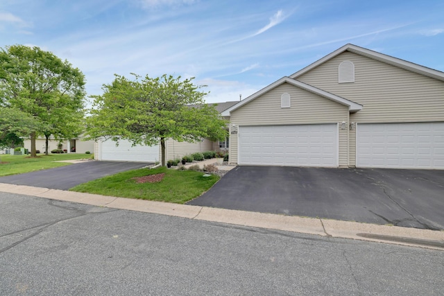 10777 181st Cir NW, Elk River, MN 55330 - view of front of property with asphalt driveway and a front yard