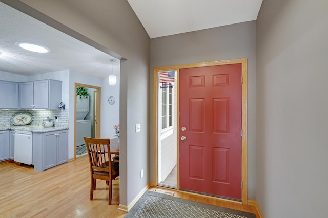 10777 181st Cir NW, Elk River, MN 55330 - foyer featuring light wood-style floors and washer / clothes dryer
