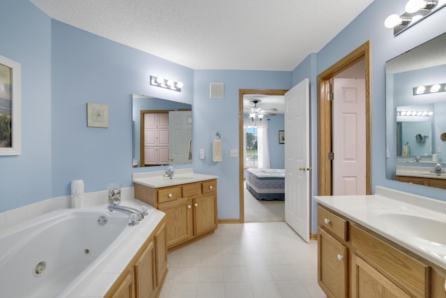 10777 181st Cir NW, Elk River, MN 55330 - full bath featuring ensuite bath, a ceiling fan, two vanities, a jetted tub, and a textured ceiling