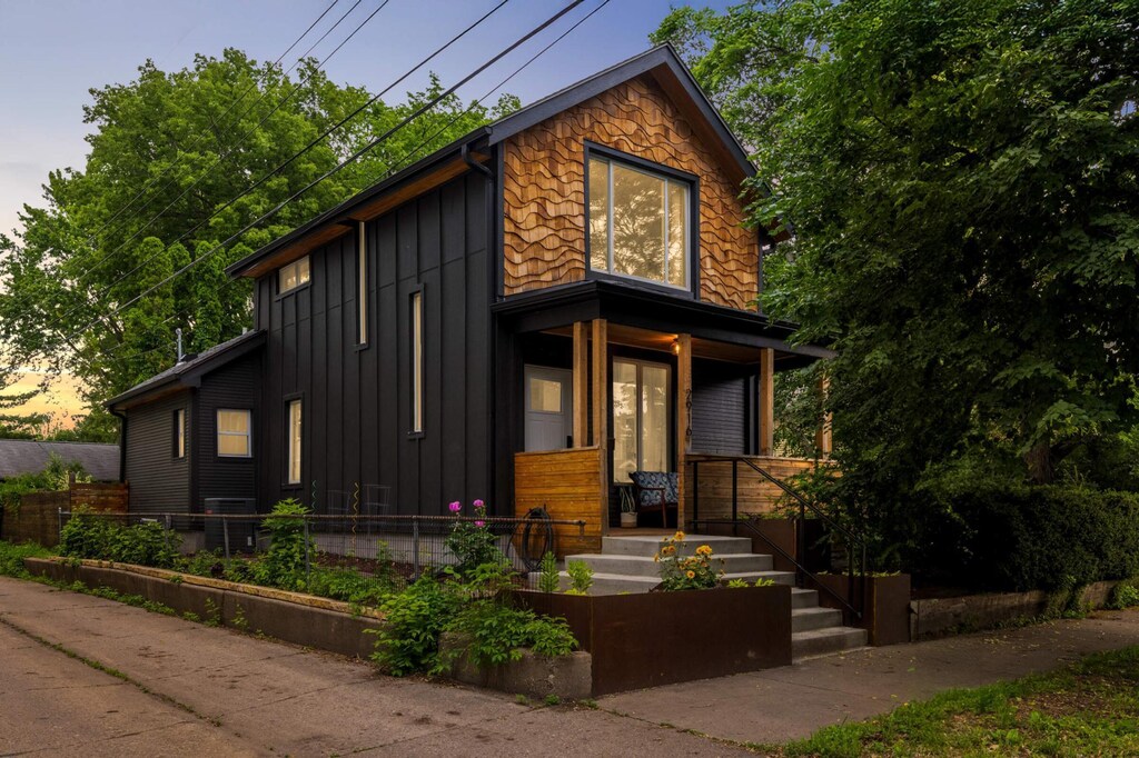2916 26th St, Minneapolis, MN 55406 - view of front of home featuring covered porch and board and batten siding