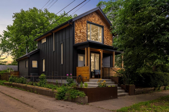 2916 26th St, Minneapolis, MN 55406 - view of front of home featuring covered porch and board and batten siding