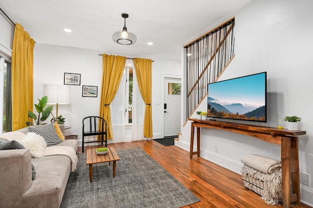 2916 26th St, Minneapolis, MN 55406 - living room featuring stairway, wood finished floors, recessed lighting, and baseboards