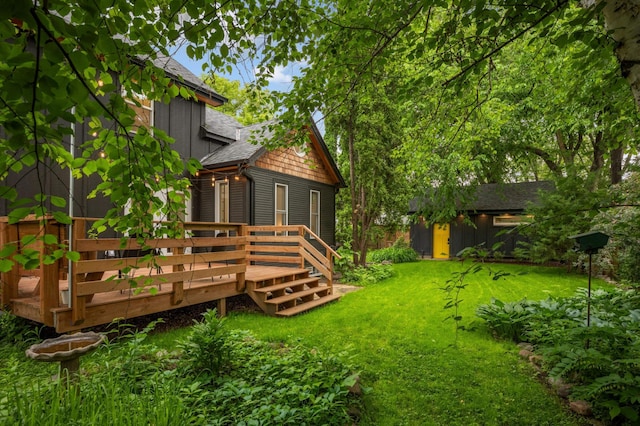 2916 26th St, Minneapolis, MN 55406 - view of grassy yard with a deck and an outdoor structure