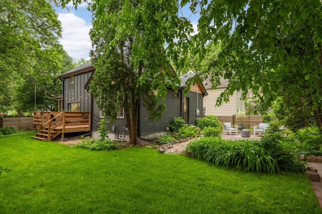 2916 26th St, Minneapolis, MN 55406 - view of yard with a deck and a patio