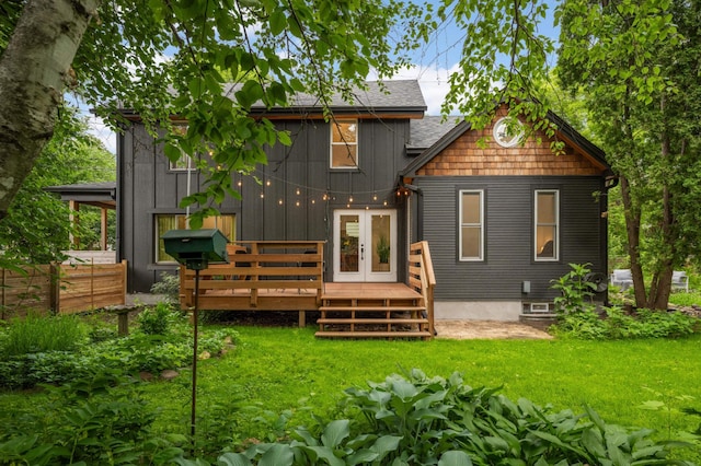 2916 26th St, Minneapolis, MN 55406 - back of house with a wooden deck, a yard, roof with shingles, and french doors