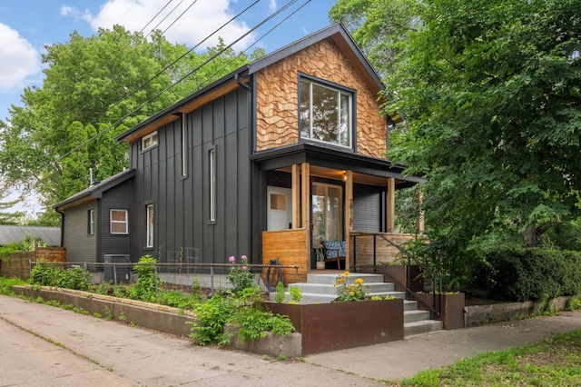 2916 26th St, Minneapolis, MN 55406 - view of front of property featuring board and batten siding and covered porch