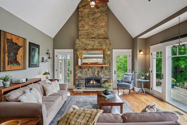 1755 Chateau Way, Minnetrista, MN 55359 - living area featuring high vaulted ceiling, wood finished floors, a fireplace, and ceiling fan