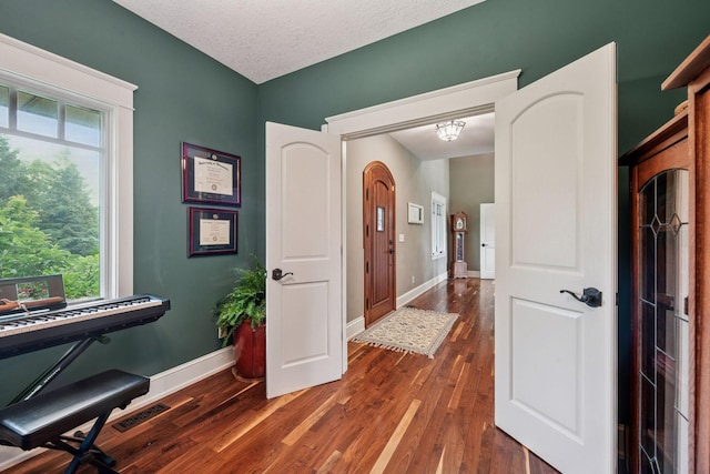 1755 Chateau Way, Minnetrista, MN 55359 - entryway with dark wood-style flooring and a textured ceiling